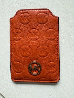 Michael Kors Orange Pebbled Leather Phone Sleeve with MK Medallion